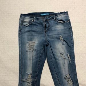 ripped skinny jeans, one belt loop is broken